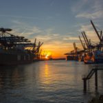 low saturated photo of oil rig during golden hour